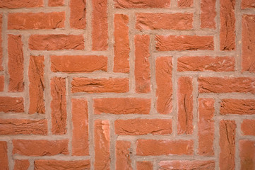 Brick wall with diagonal herringbone pattern