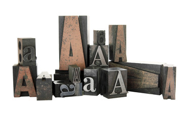 the letter A in both wood and metal type