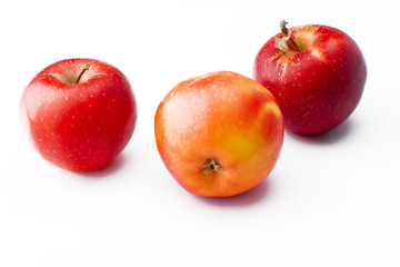 Three apples on white