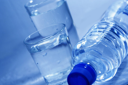 Bottle and glasses of mineral water 