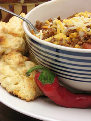 Chili with biscuits and a pepper