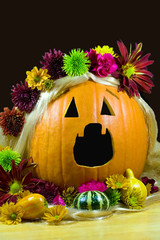 Flower covered blond singing jack-o-lantern