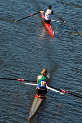 Two rowing boats competing with each other