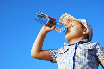 Pretty child drink fresh water