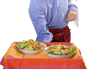 Waiter serves salads