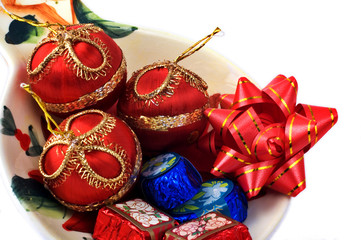 Fototapeta na wymiar Chocolates and Christmas ornaments