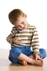 Little boy speaks by phone