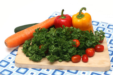 Parsley, cherry tomatoes, capsicums, carrot and cucumber