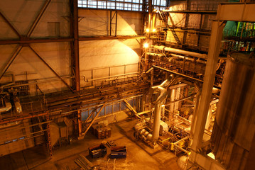 Equipment, cables and piping as found inside of a modern industr