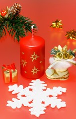 Red christmas still-life with candle and decorations