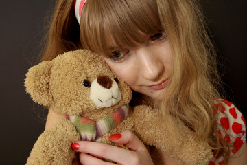 Girl with bear toy