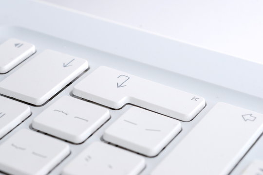 white computer keyboard enter - Powered by Adobe