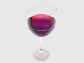 Glass of red wine isolated on gray background