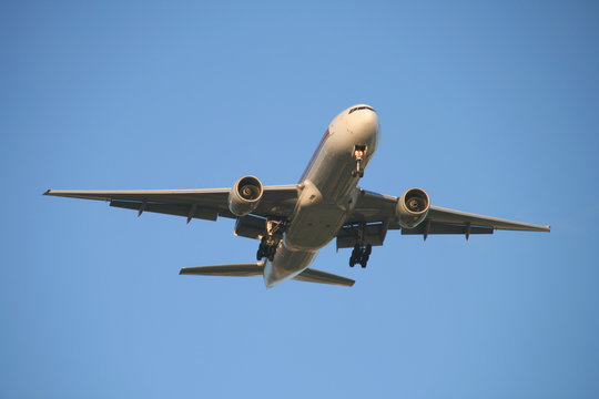 front view of a jet plane on final approach 