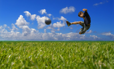 Boy playing soccer - clipping path