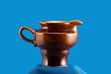 Stylish east milk jug on blue