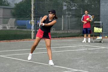 ethnic tennis player taking lesson