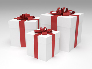 three white gift boxes with red ribbon and bow
