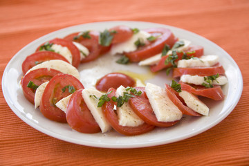 Italian salad with tomato, mozzarella and basil