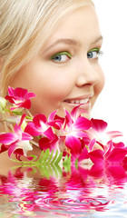 lovely blond with orchid in water