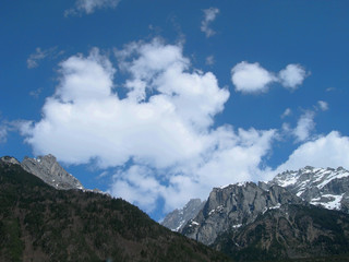 Fototapeta premium Blue sky over Swiss Alps with a hint of snow