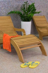 sunbed with orange towel vertical