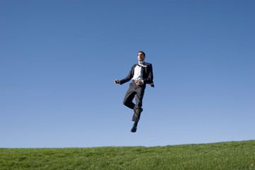 Businessman jumping