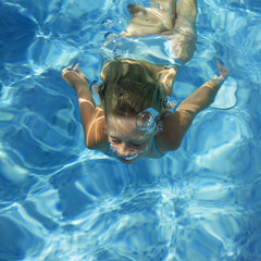 girl swimming in a swimming pool
