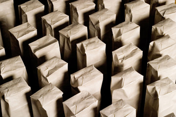 The army of paper bags on black