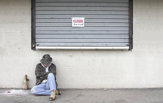 Homeless Man By a Bankrupt Business