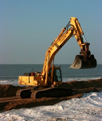 Excavator working on the seaside