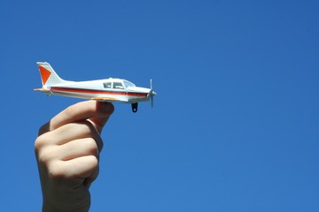 boy holding toy airplane