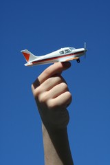 boy holding toy airplane