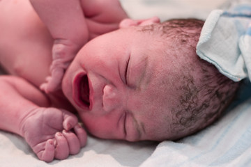 Newborn crying in delivery room