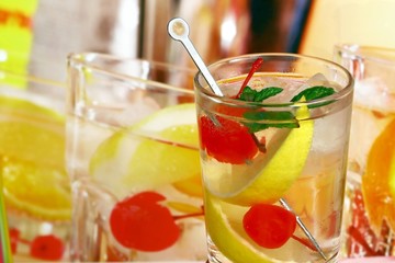 Summer alcoholic recreational drink with cherry and lemon