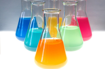 Test tubes isolated fulled with different color chemicals