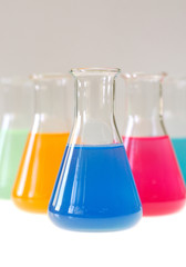Test tubes isolated fulled with different color chemicals