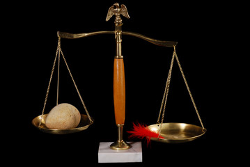 Balance Scales With Feather And Rock