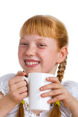 Red-haired girl with a milk mug