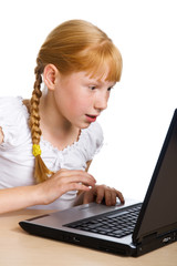 Girl having fun with computer game