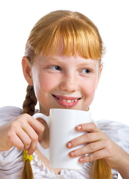 Red-haired girl with a milk mug
