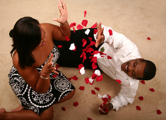 African American CoupleThrowing Rose Petal - 5036094