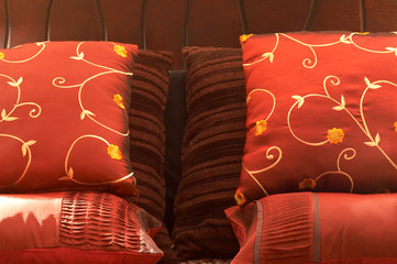 Colorful cushions on the bed