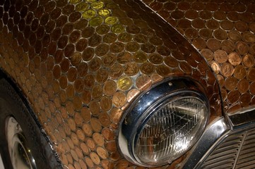 Old car decorated with coins