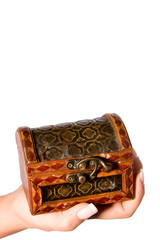 Hand holding a small treasure chest