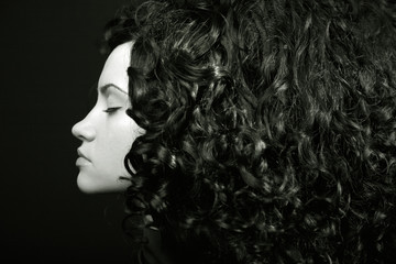 Elegant girl with curly hair