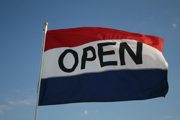 open flag with blue sky