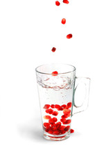 pomegranate corn fall in glass with water 