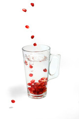 pomegranate corn fall in glass with water 