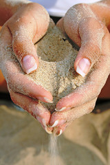 sand in beautiful hands